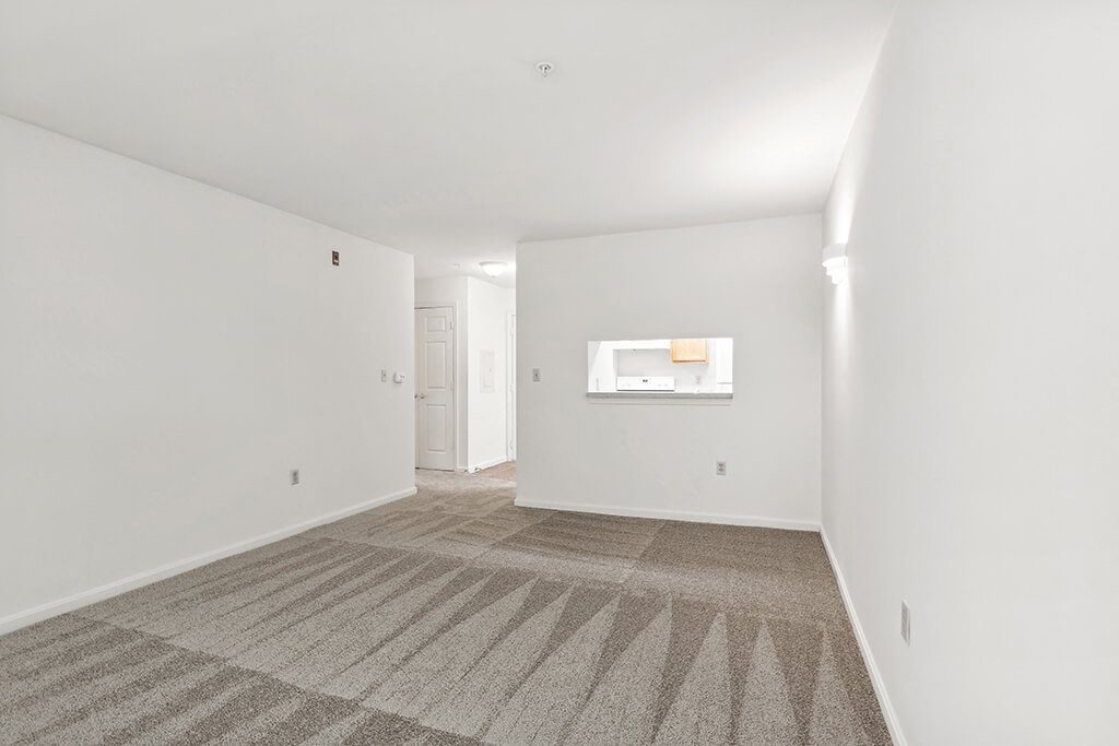 Living room with carpet at Fairbrooke Senior Apartments in Aberdeen MD
